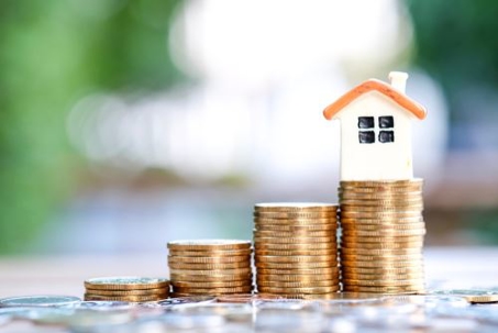 Coins and a Toy House